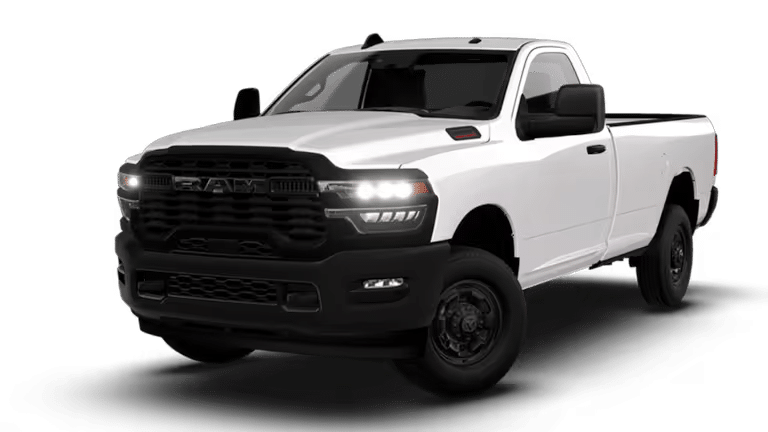 White pickup truck with a black grille and modern headlights, showcasing a rugged design.