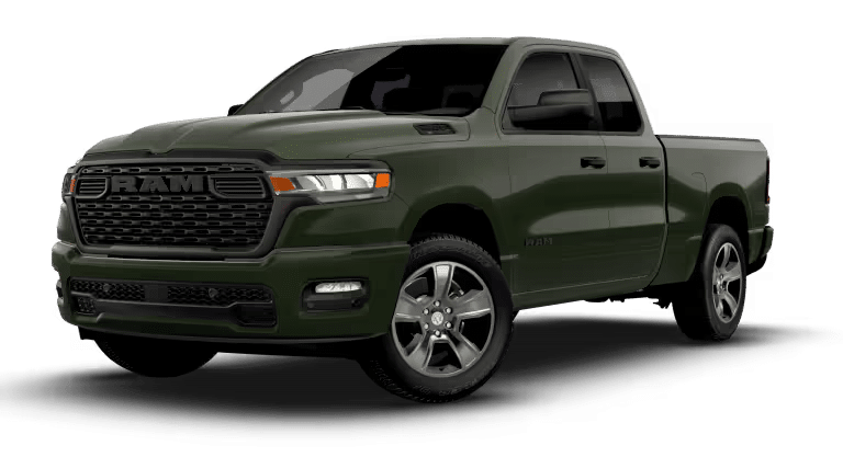 Green RAM pickup truck with a bold grille and alloy wheels, viewed from the front side angle.