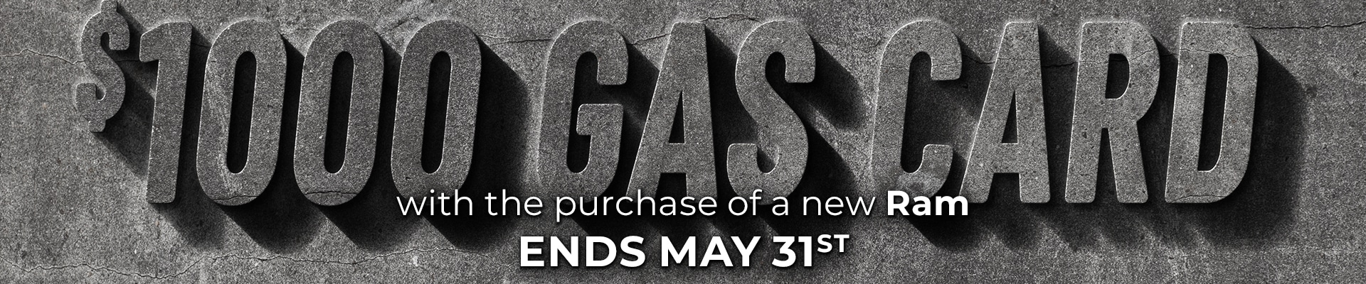 $1000 gas card offer with new Ram purchase. Ends May 31st. Rugged stone-textured text.