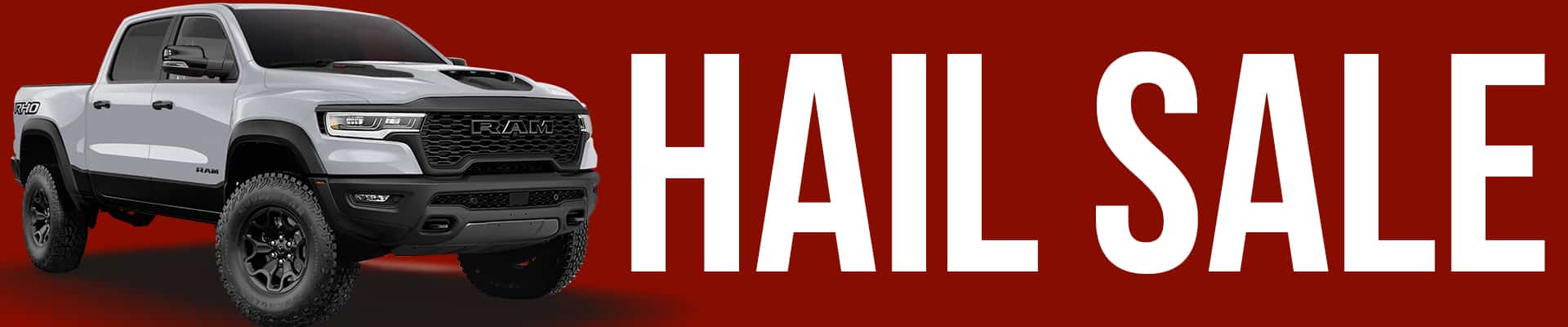Silver RAM truck on red background with bold white "HAIL SALE" text promoting a special offer.